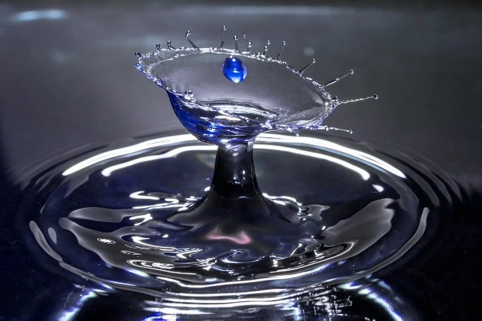 water drop in blue glass